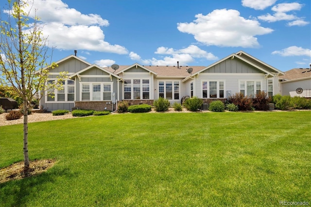 14443 W 88th Dr Unit B, Arvada, CO 80005 - back of property featuring board and batten siding and a yard