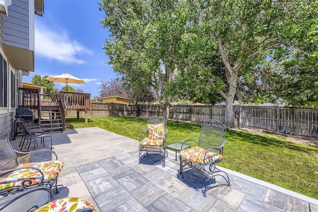 9890 Gaylord St, Thornton, CO 80229 - fenced backyard with a wooden deck, a patio, stairs, and a grill