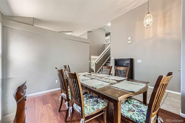 9890 Gaylord St, Thornton, CO 80229 - dining space featuring wood finished floors and stairway