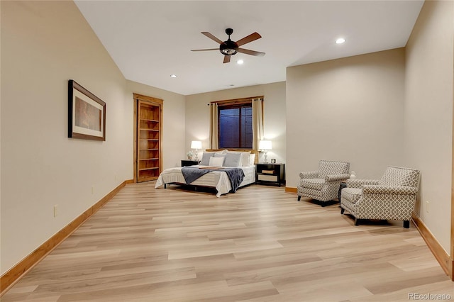 bedroom featuring ceiling fan and light hardwood / wood-style flooring