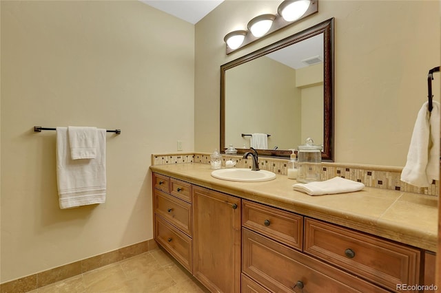 bathroom featuring tile patterned flooring and vanity