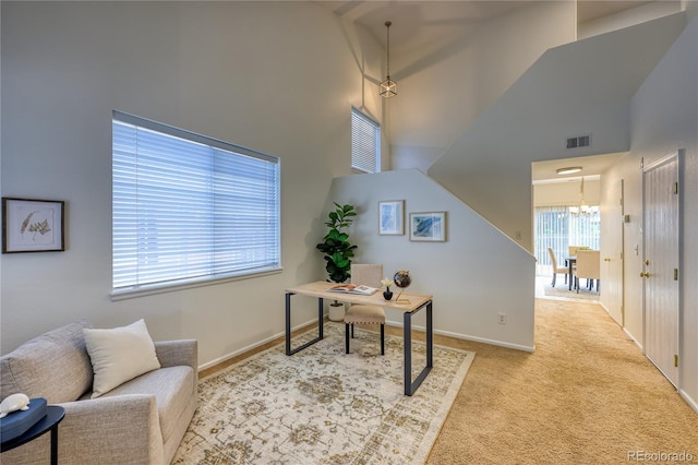 7345 S Nucla St, Aurora, CO 80016 - carpeted home office featuring a chandelier and a high ceiling