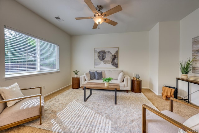 7345 S Nucla St, Aurora, CO 80016 - carpeted living room featuring a ceiling fan and baseboards