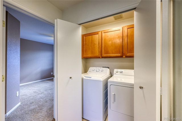 7345 S Nucla St, Aurora, CO 80016 - laundry area featuring washer and clothes dryer, cabinet space, and carpet floors