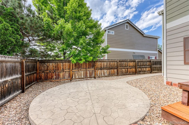 7345 S Nucla St, Aurora, CO 80016 - fenced backyard featuring a patio