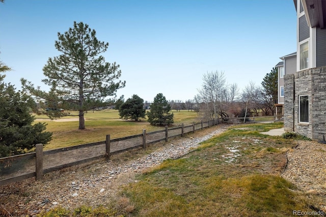 view of yard with a rural view