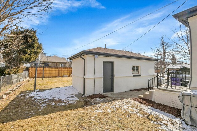 view of outbuilding with a fenced backyard and an outdoor structure