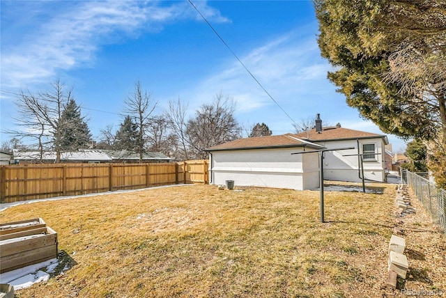 view of yard with a fenced backyard