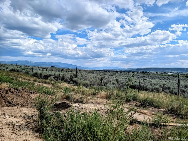 mountain view featuring a rural view