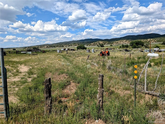 mountain view featuring a rural view