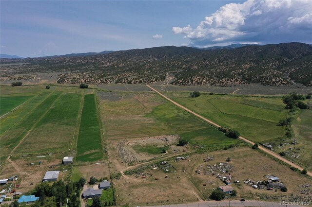 drone / aerial view with a mountain view and a rural view