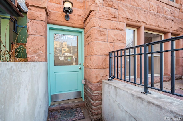 entrance to property with stone siding