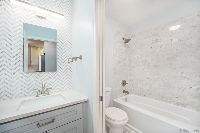 full bathroom featuring toilet, tub / shower combination, and vanity