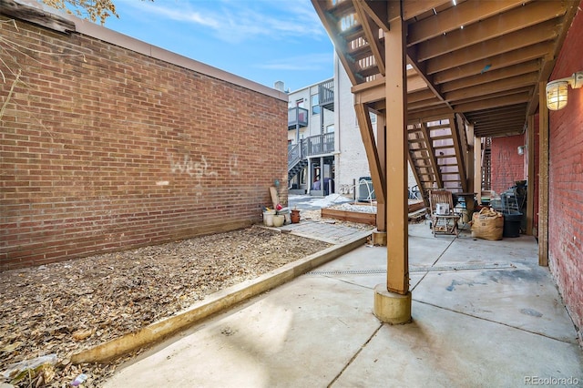 view of patio / terrace featuring stairs