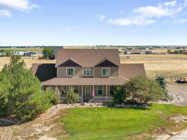 32401 E 147th Ave, Brighton, CO 80603 - country-style home with covered porch, a front yard, and roof with shingles