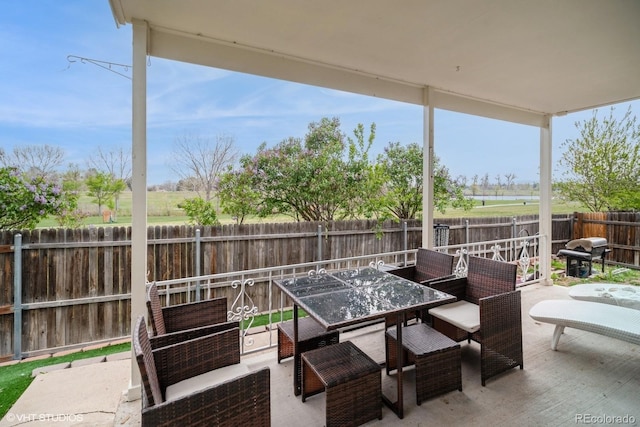 view of patio with outdoor lounge area, outdoor dining space, a fenced backyard, and a grill