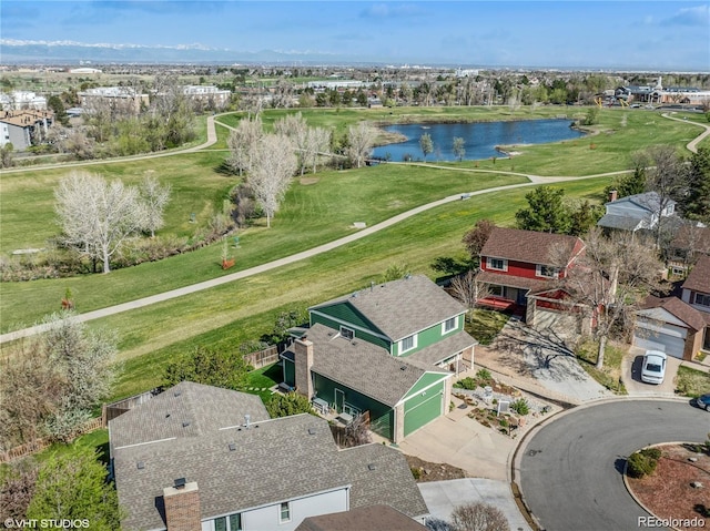 birds eye view of property featuring a residential view and a water view