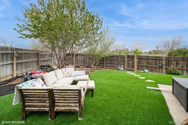 view of yard featuring an outdoor hangout area and a fenced backyard