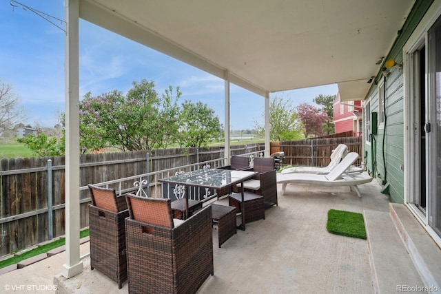view of patio / terrace featuring outdoor dining area and a fenced backyard