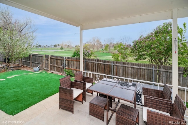 view of patio / terrace with a fenced backyard and outdoor dining space