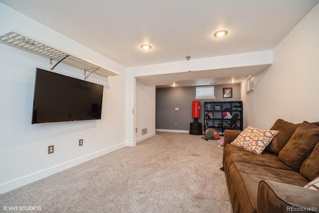 living room with carpet flooring, baseboards, and visible vents