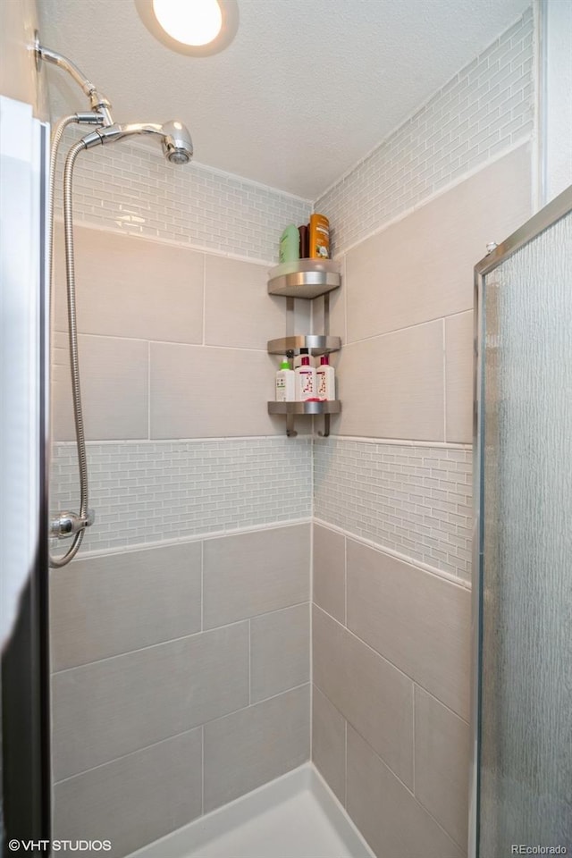 full bathroom featuring a shower stall