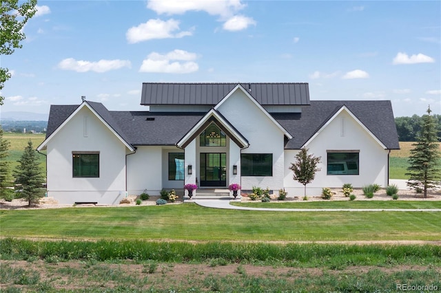 modern inspired farmhouse featuring a front yard