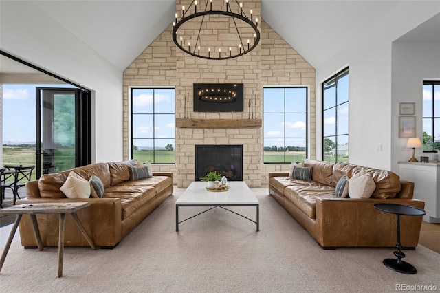 living room featuring high vaulted ceiling, a fireplace, and plenty of natural light