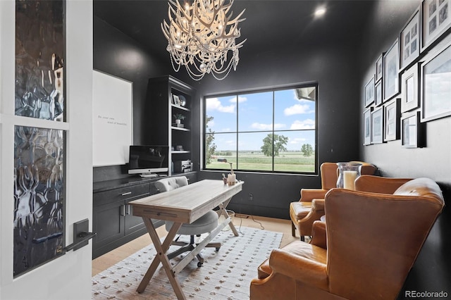 office space with a notable chandelier and light hardwood / wood-style floors