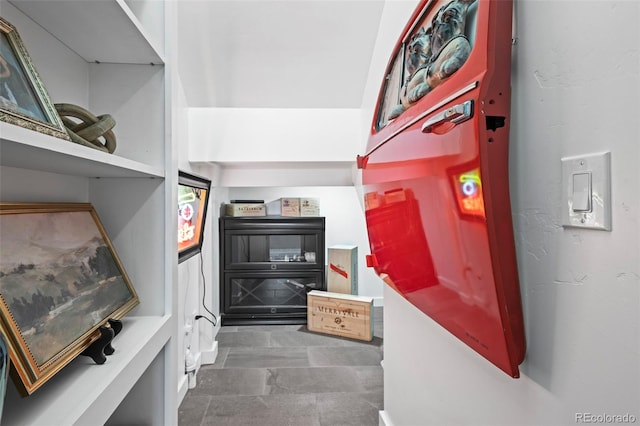 interior space featuring dark tile floors