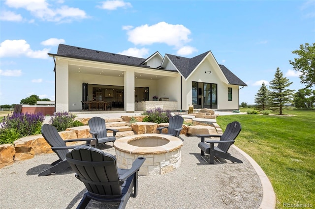 view of patio with a fire pit