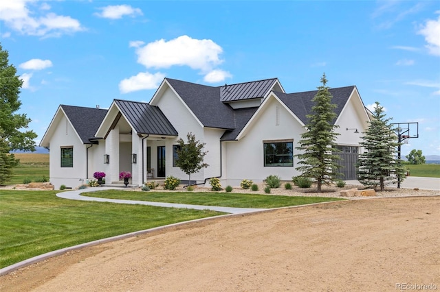 modern farmhouse featuring a front lawn