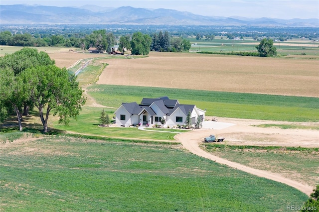 drone / aerial view with a mountain view and a rural view