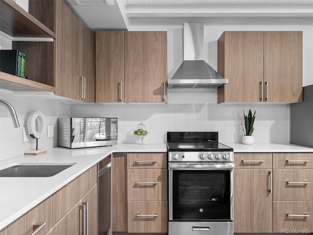 kitchen with open shelves, appliances with stainless steel finishes, a sink, modern cabinets, and wall chimney exhaust hood