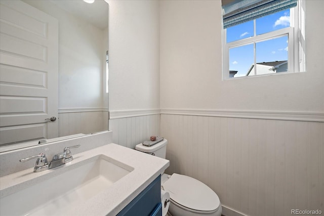 bathroom featuring toilet and vanity