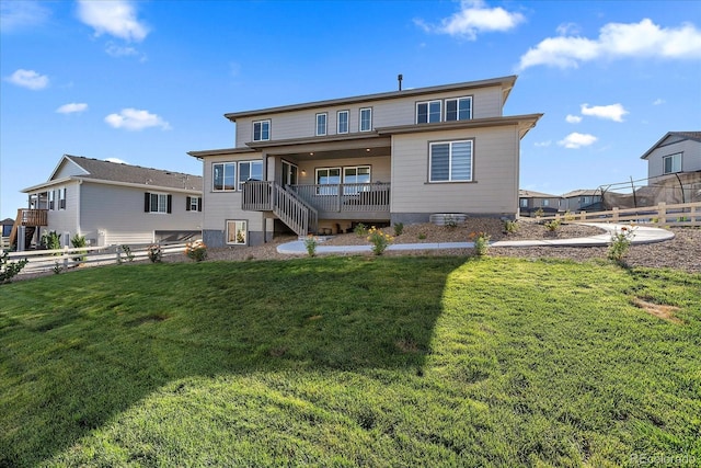 back of house featuring a lawn