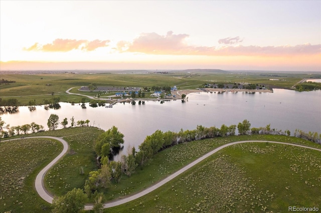 aerial view at dusk with a water view