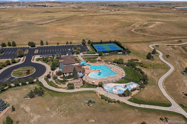 birds eye view of property with a rural view