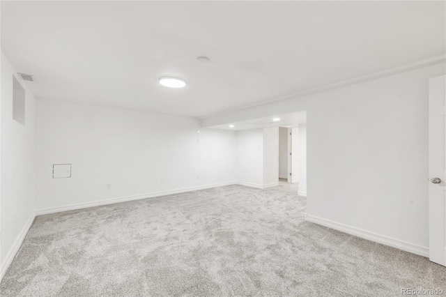 unfurnished room with light colored carpet