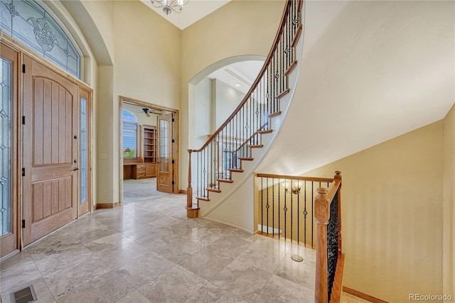 foyer with a towering ceiling