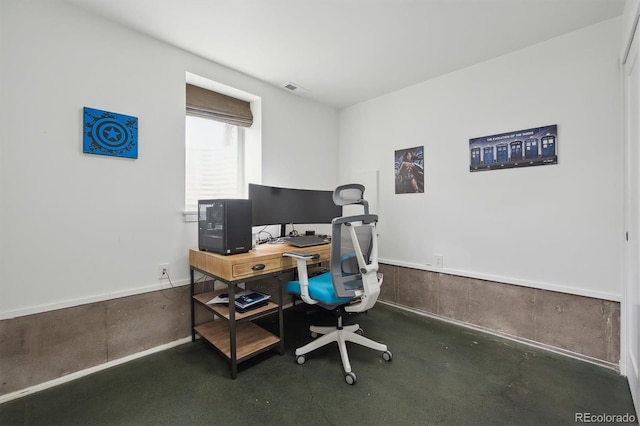 office area with finished concrete flooring and visible vents