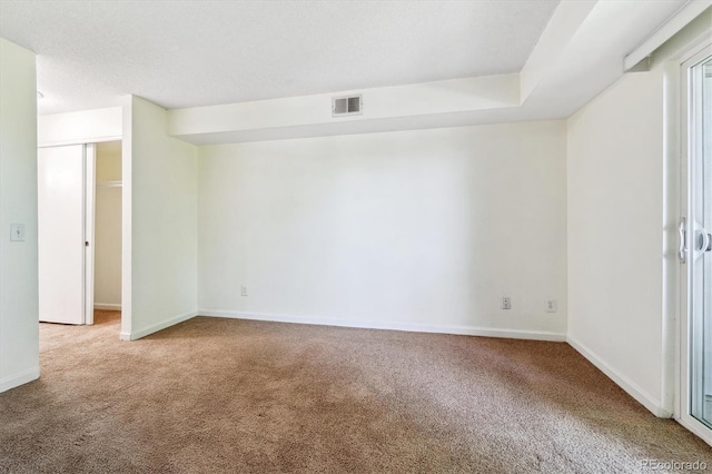 empty room with carpet flooring