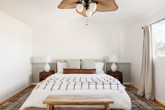 bedroom with lofted ceiling, wood-type flooring, and ceiling fan