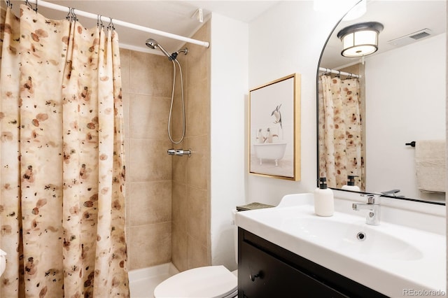 bathroom with vanity, a shower with curtain, and toilet