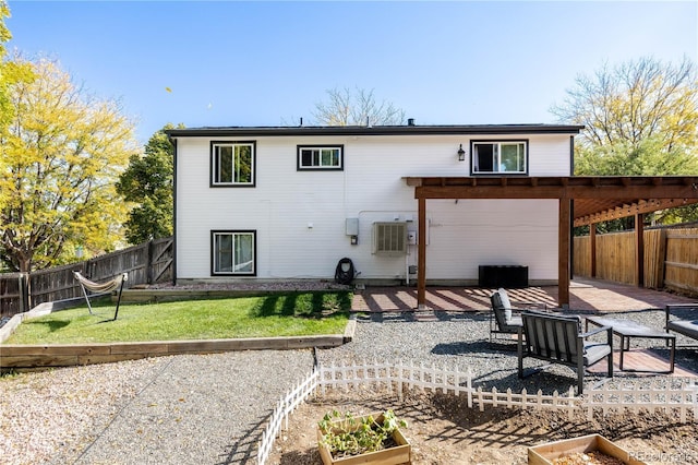 back of property featuring a patio and a lawn