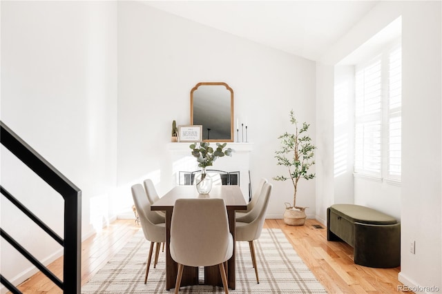 dining area with light hardwood / wood-style flooring