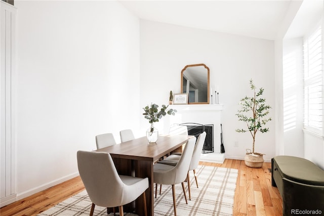 dining space featuring light wood-type flooring