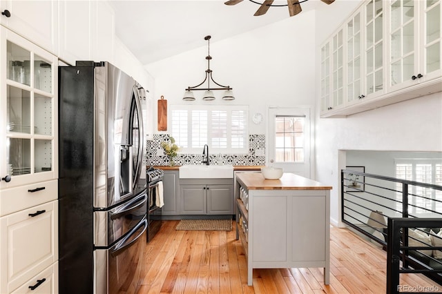 kitchen featuring appliances with stainless steel finishes, gray cabinets, sink, and white cabinets