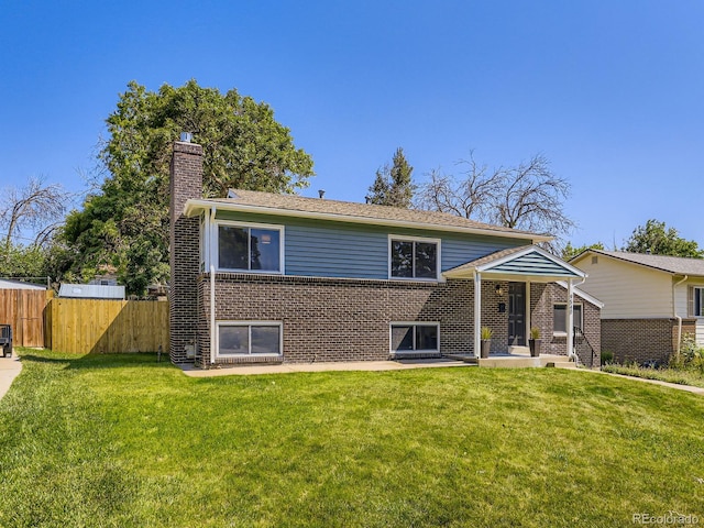 9540 King Way, Westminster, CO 80031 - view of front facade featuring a chimney and brick siding