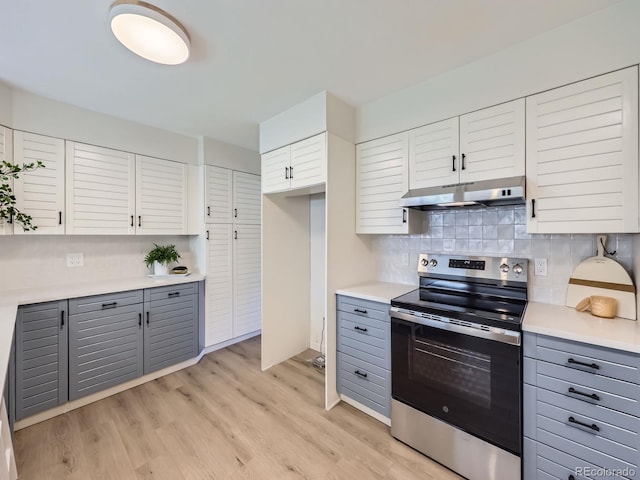 9540 King Way, Westminster, CO 80031 - kitchen with stainless steel electric range oven, under cabinet range hood, gray cabinets, and backsplash